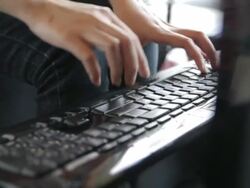 Girl Typing at Keyboard,Dolly shot Stock Footage