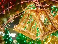 Golden bell on christmas tree Stock Footage
