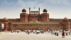 Tourists walk about the courtyard in front of the Lahore Gate in front of the Red Fort in Old Delhi. Stock Footage