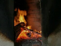 burning wood in a tandoor Stock Footage