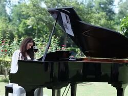 Young woman playing a piano  Stock Footage