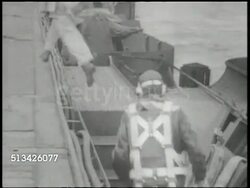 1940s: UNITED STATES NAVY: MS U.S. Navy officer telling flight controller to 'tell pilots to man their planes.' VS Pilots running up onto aircraft carrier deck, climbing into fighter airplanes (could be Corsairs), giving signals. WWII, Pacific Front Instructional Video