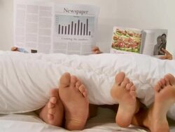 Reading In Bed Stock Footage