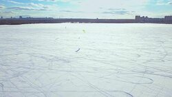 Kite skiing in winter - aerial view Stock Footage