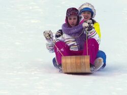 Young girls Tobogganing in Super Slow motion Stock Footage