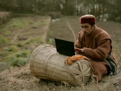 People of Himachal Pradesh: Young farmer using laptop Stock Footage