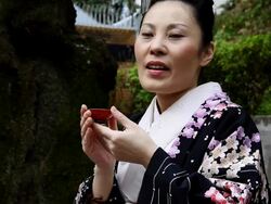 Japanese Woman Posing with Sake Cup Stock Footage