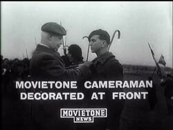 MOVIETONE CAMERAMAN DECORATED AT FRONT - News Clip