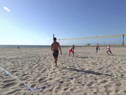 Men playing beach volleyball. Stock Footage