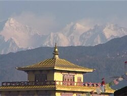 Tibetan monastery, Kathmandu, Nepal, with snowcapped Himalayas and Prayer Flags Stock Footage