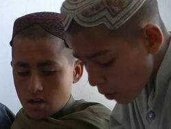 CU Students sitting in classroom wearing traditional clothing / Musa Qala, Helmand Province, Afghanistan. Stock Footage