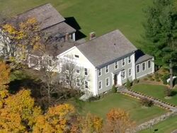 MS AERIAL DS PAN ZO Shot of small house surrounded by nesting tree / Connecticut, United States Stock Footage