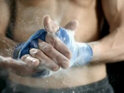 HD Super Slow-Mo: Gymnast Chalking His Hands Stock Footage