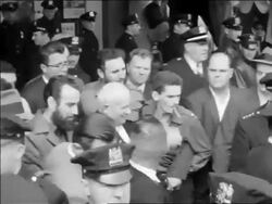B/W 1960 high angle PAN Fidel Castro + Nikita Khrushchev walking thru crowd smiling + waving / USA Stock Footage