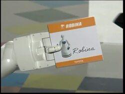 Toyota shows off 3 robots, including new violin-playing robot News Clip