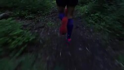 Ultra marathon runner running outdoors in the woods Stock Footage