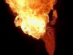 HD Super Slow-Mo: Fire Breather On Black Background Stock Footage