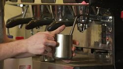 Barista warming or frothing milk News Clip