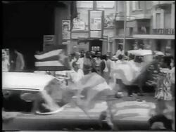 B/W 1959 PAN women carrying flags walk thru celebration of revolution / Havana / newsreel Stock Footage