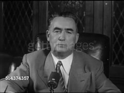 1952: SECRETARY OF LABOR: Department of Labor lettering on building, TRACKING Union leader AFL President Martin P. Durkin (1894-1955) walking up sidewalk into building, MS Durkin, SOT saying was surprised, am a democrat, will try hard, do best. Instructional Video