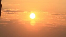 Sunrise through flowing cloud waves, mountain Stock Footage