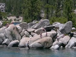 Lake Tahoe Sand Harbor Park rock formation kids jump Stock Footage