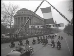B/W motorcycle police escort and welcome banner / 1940's / No SOUND Stock Footage