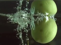 CU SLO MO Shot of Apple and lemon falling into water / Seoul, South Korea Stock Footage