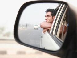 Reflection of a man watching from window of a car  Stock Footage