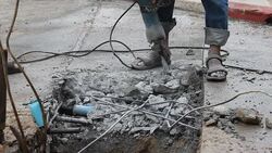 Labor people Drilling asphalt road Stock Footage