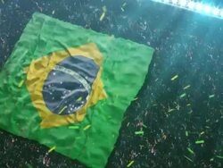 Fans unfurl majestic Flag of Brazil at the stadium Stock Footage