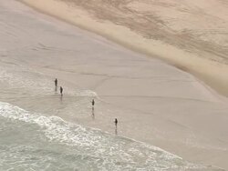 CU AERIAL ZO View of fisherman at Cape Hatteras National Seashore / North Carolina, United States Stock Footage