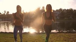 Athletic Twins Running Park Slow-Motion Stock Footage
