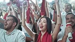 Group of fans cheering for sports team Stock Footage