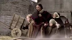 A mother and her children flee London as smoke drifts through the city during the Great Fire. Stock Footage