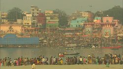 Throngs of people prepare to bathe in the Ganges River. Stock Footage