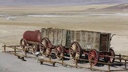An old wagon train at the Harmony Borax works in Death Valley which is the lowest, hottest, driest place in the USA, with an average annual rainfall of around 2 inches, some years it does not receive any rain at all. Stock Footage