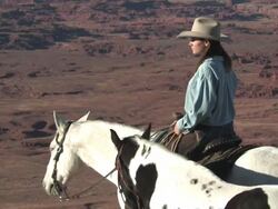 MS ZO Women with Horses over looking spectaculair Red Rock Canyons, Majestic Western Landscapes / Telluride, Colorado, United States Stock Footage