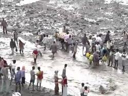People crossing river after bridge fell down Stock Footage