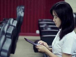 Collegian typing on digtal table Stock Footage