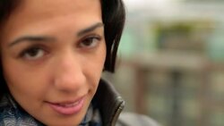 Young woman in love looks up and smiles sweetly at camera Stock Footage