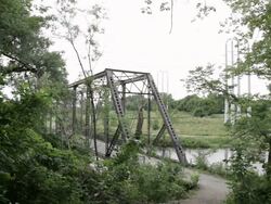 WS Two young girls running and exercising together in urban setting near bridge and river / Minneapolis, Minnesota, United States Stock Footage