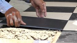 slow-motion, construction worker tiling ceramic tiles floor Stock Footage