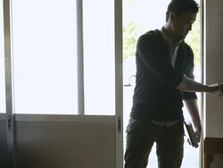 MS PAN Shot of wood worker entering furniture factory / Kyoto, Japan Stock Footage