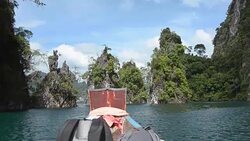 backpacker on boat in landmark of Cheow Lan lake, Thailand Stock Footage