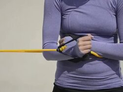 ECU CU of female beach volleyball player stretching and using bands to warm up. Stock Footage