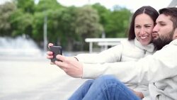 young adult couple taking selfie on the smartphone Stock Footage