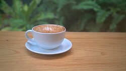 hot caramel macchiato on wood table Stock Footage