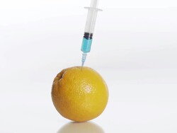 HD SLOW MOTION: Syringe Stabbing Into An Orange Stock Footage