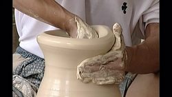 Man doing pottery in Chinese factory News Clip